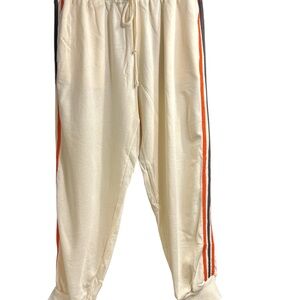 Ces Femme Cream Joggers with Orange and Black Accents